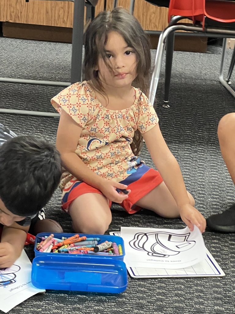 Lilith colors her backpack