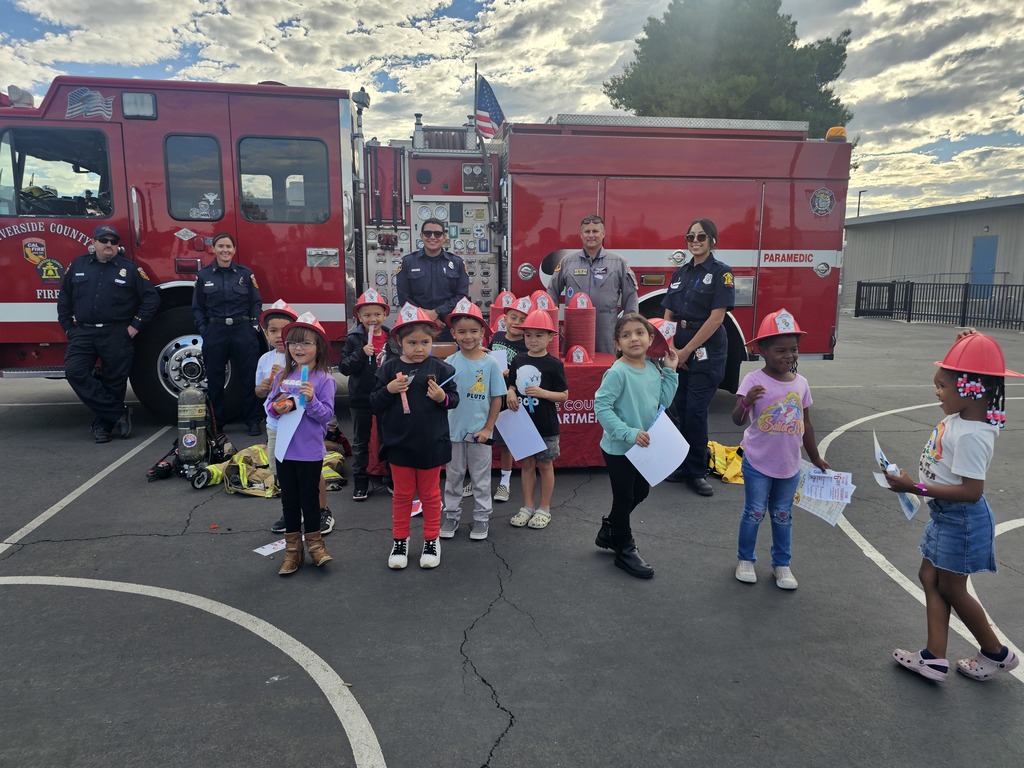 Elementary students engaged in career based activities with Fire Department