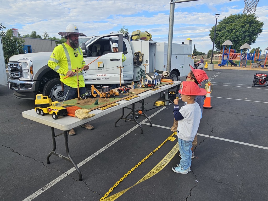 Elementary students engaged in career based activities with construction