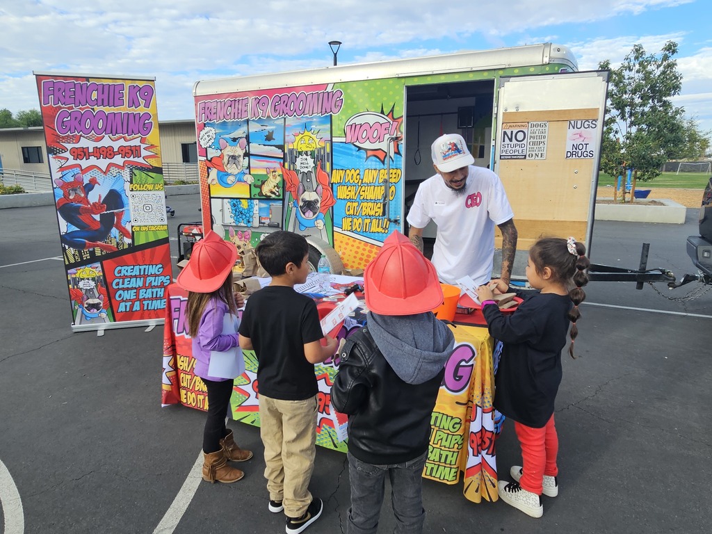 Elementary students engaged in career based activities with pet grooming