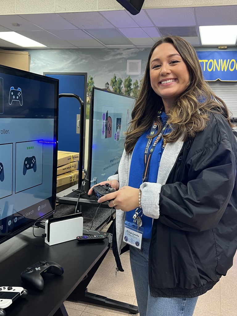 Ms. Gonzales setting up the gaming stations