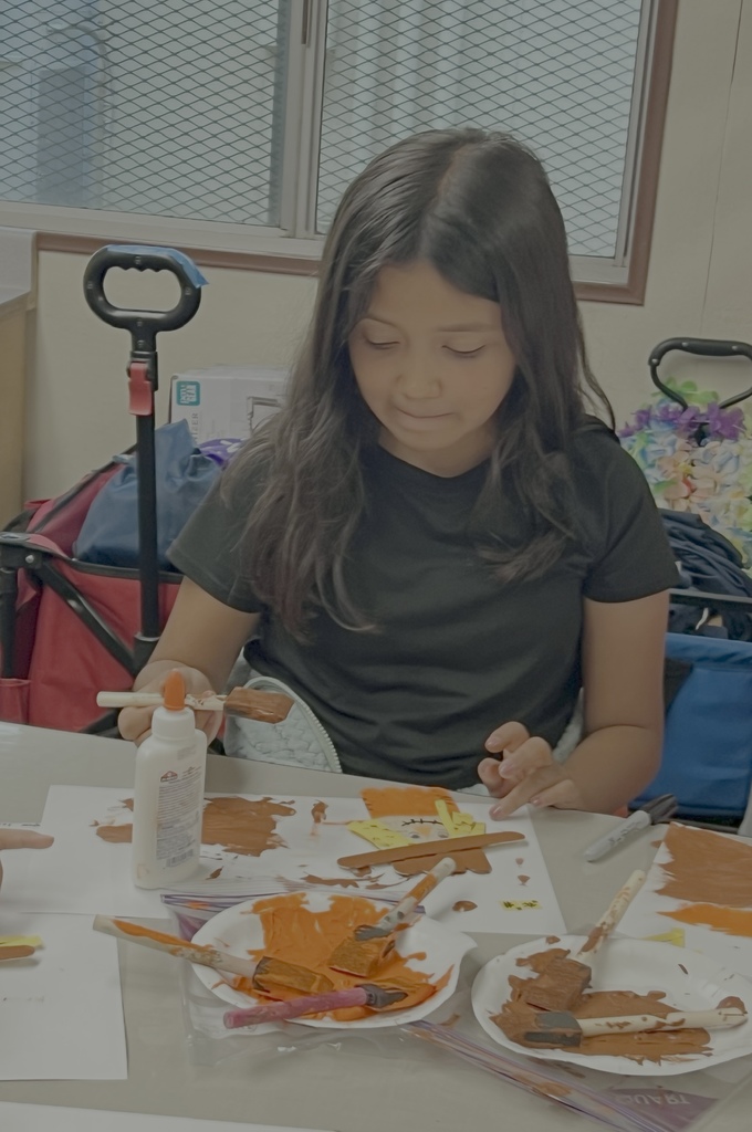 Elodia's Painting her Scarecrow