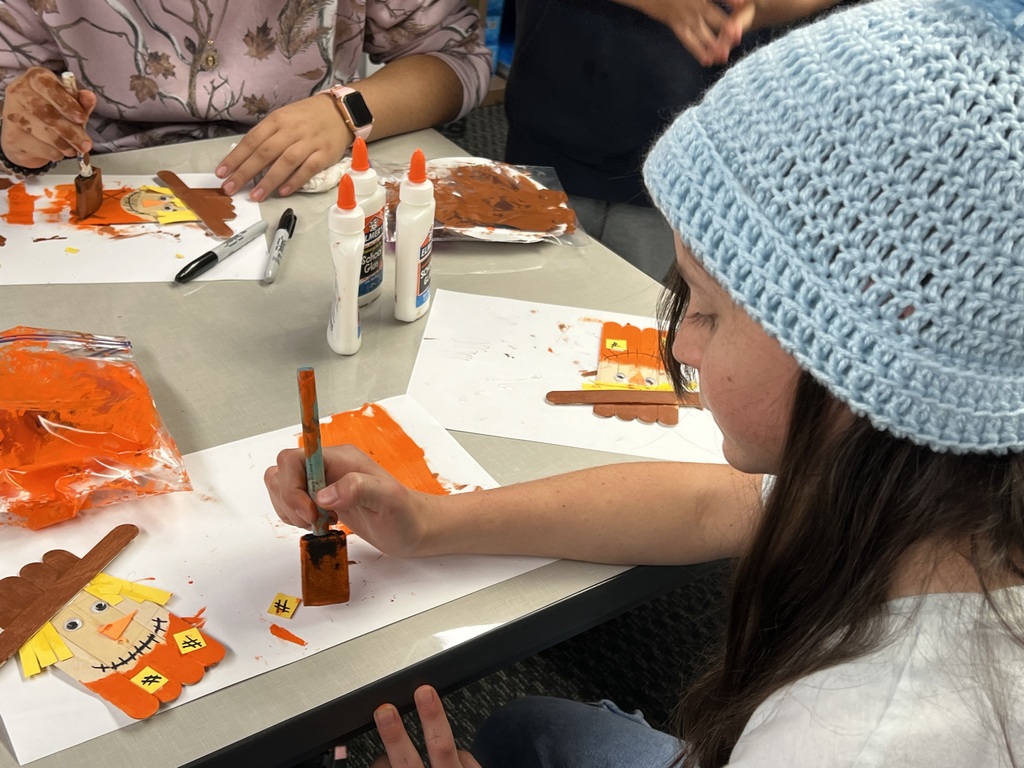 Sage painting her Scarecrow