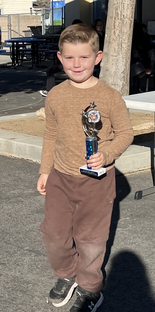 Landon picked up the trophy for his class' winning attendance percentage,