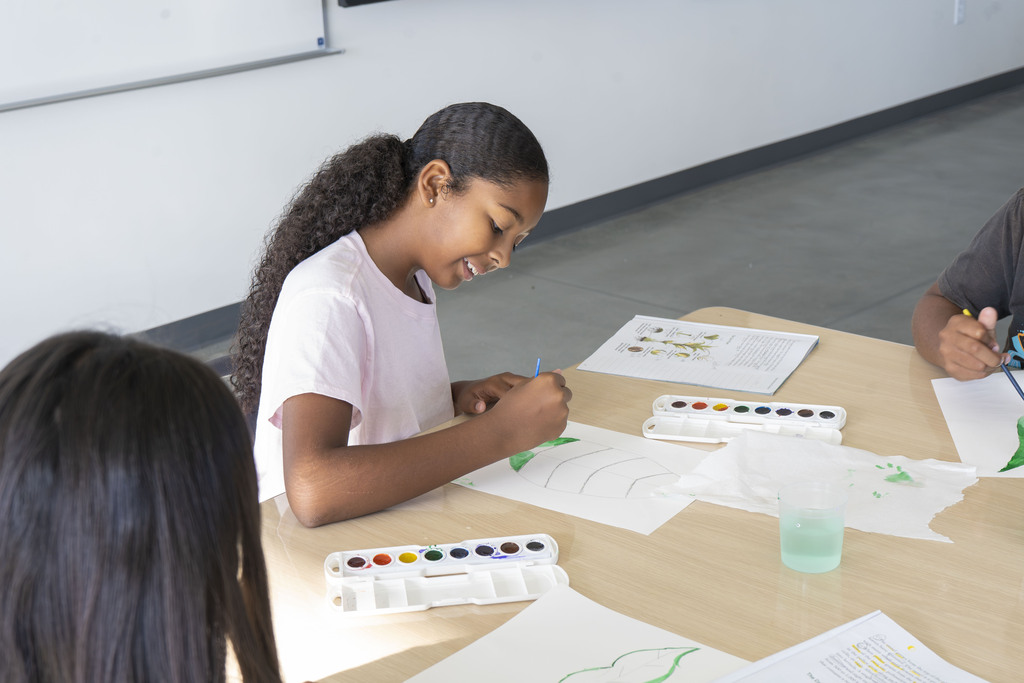 student working on art