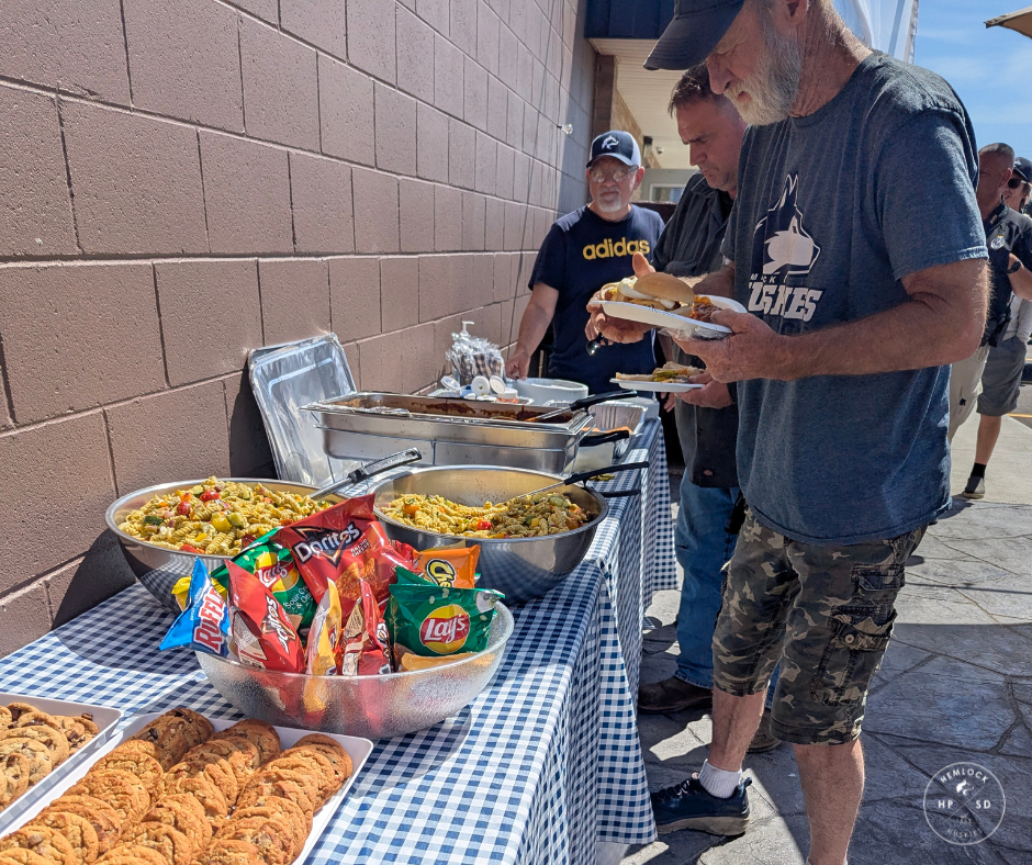 Summer workers line up on the patio to get their appreciation lunch.