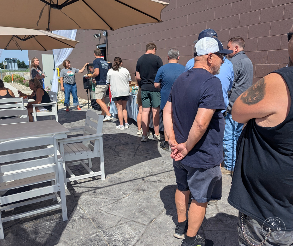 Summer workers line up on the patio to get their appreciation lunch.