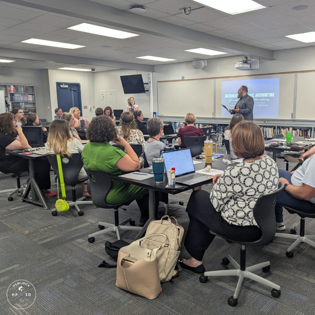Staff listen in on a meeting
