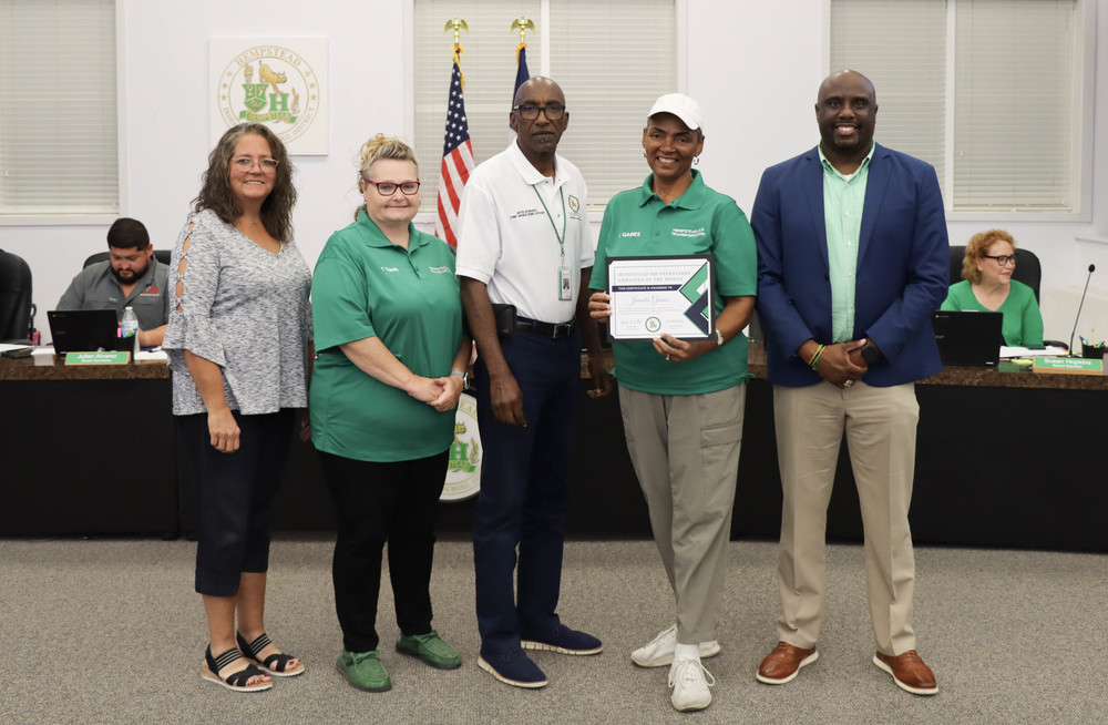 Board Meeting - Juanita Gaines with COO, Transportation, and Board President and Superintendent