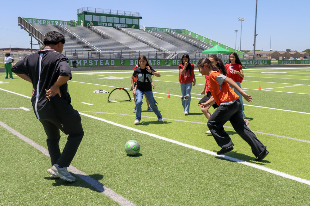 Students playing soccer