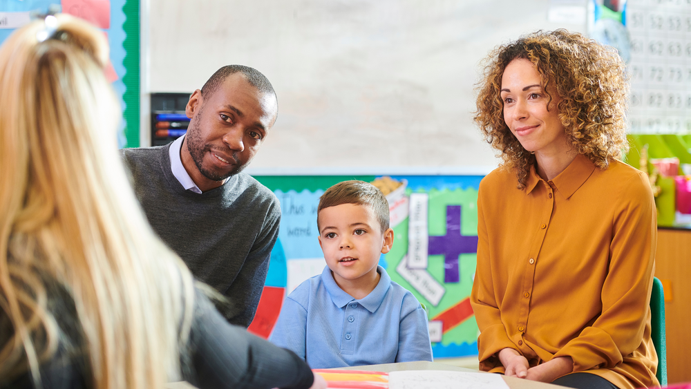 Parents and student meeting with a teacher