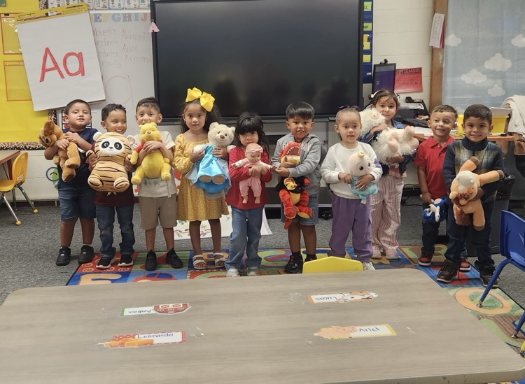 students with stuffed animals