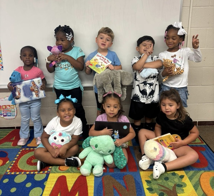 students with stuffed animals