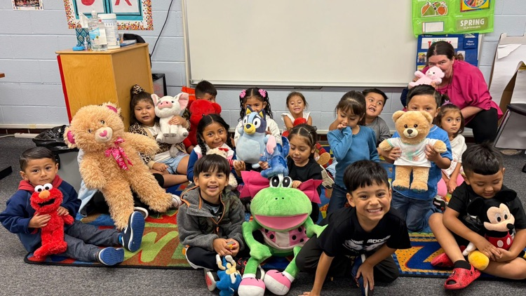 students with stuffed animals