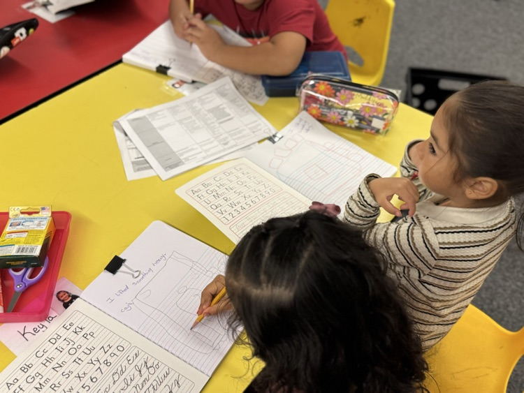 students writing in journal 