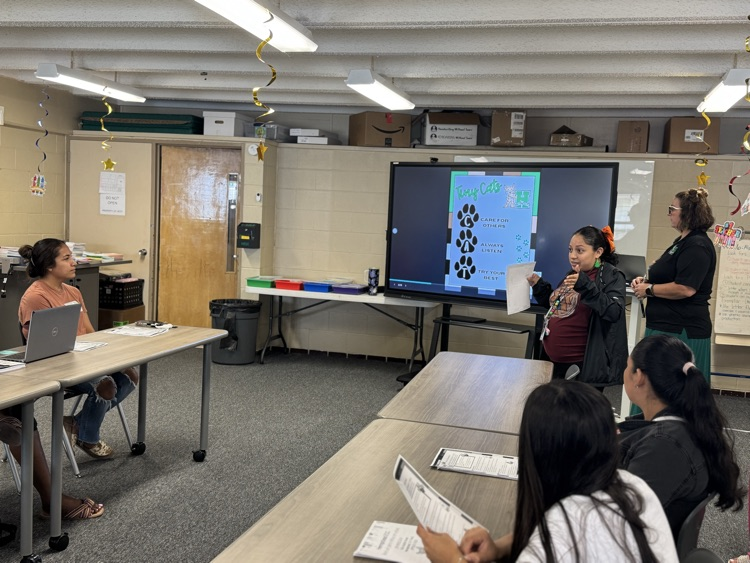 teacher talking during parent-principal chat