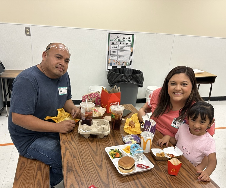 families smiling at the camera