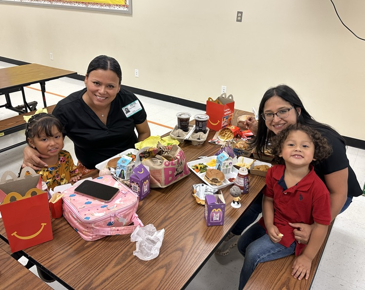 families smiling at the camera
