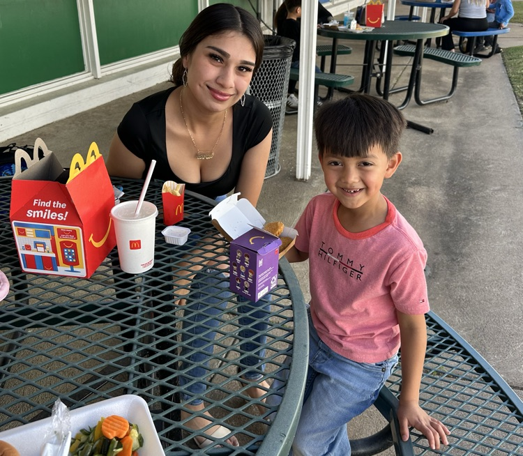 families smiling at the camera