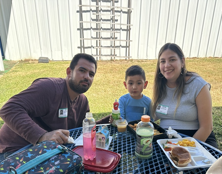 families smiling at the camera