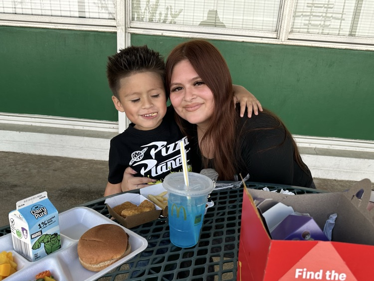 families smiling at the camera