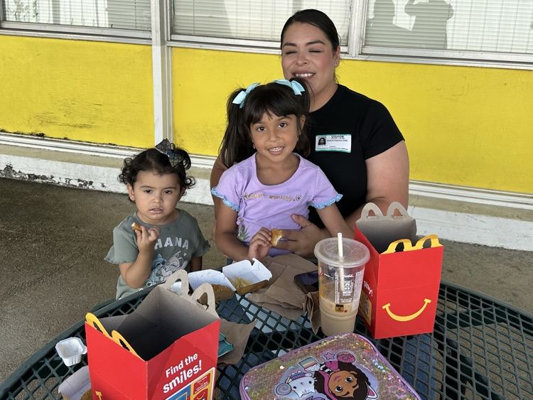 families smiling at the camera