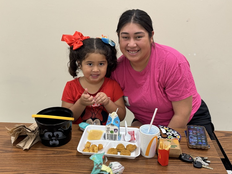 students eating with their families