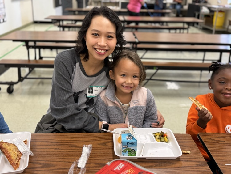 students eating with their families