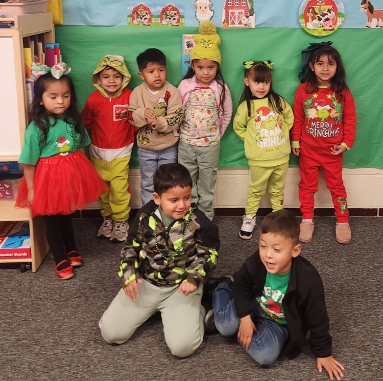 students in grinch attire