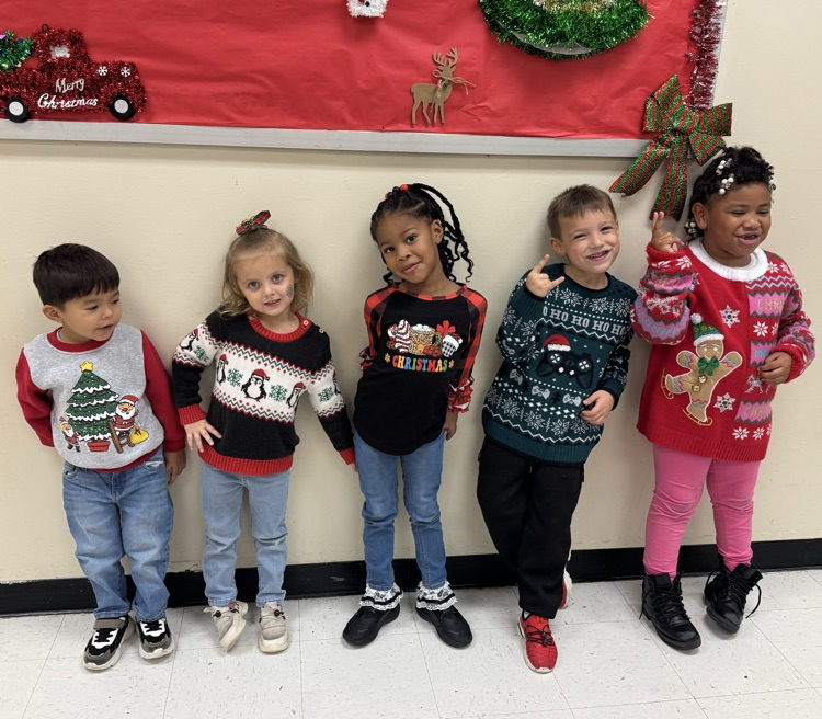 students in Christmas sweaters