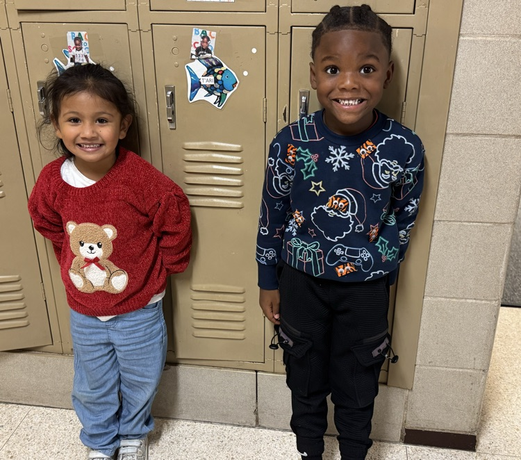 students in Christmas sweaters