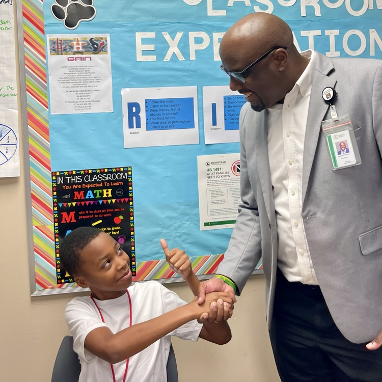 student and superintendent on first day back after winter break