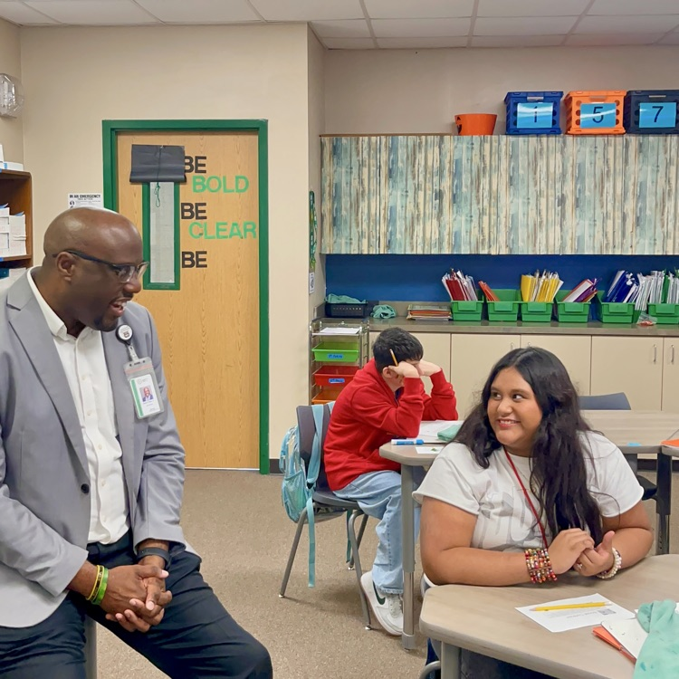 student and superintendent on first day back after winter break