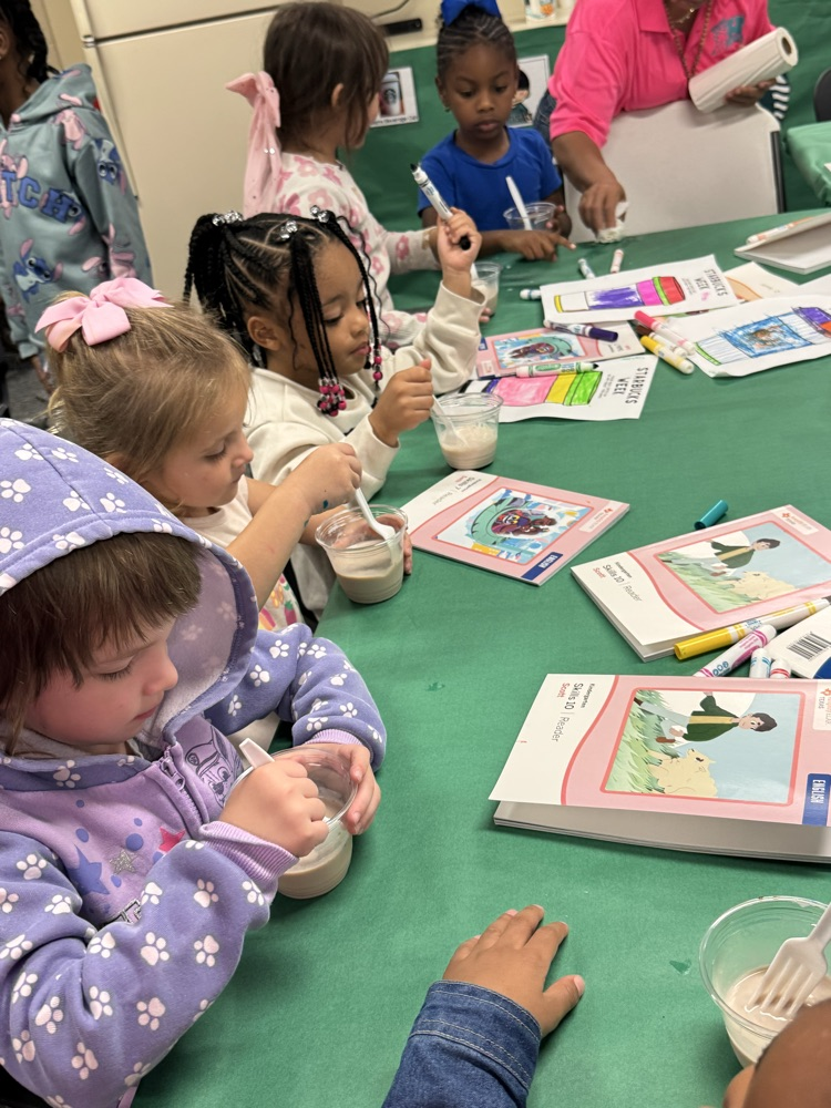 students stirring milk