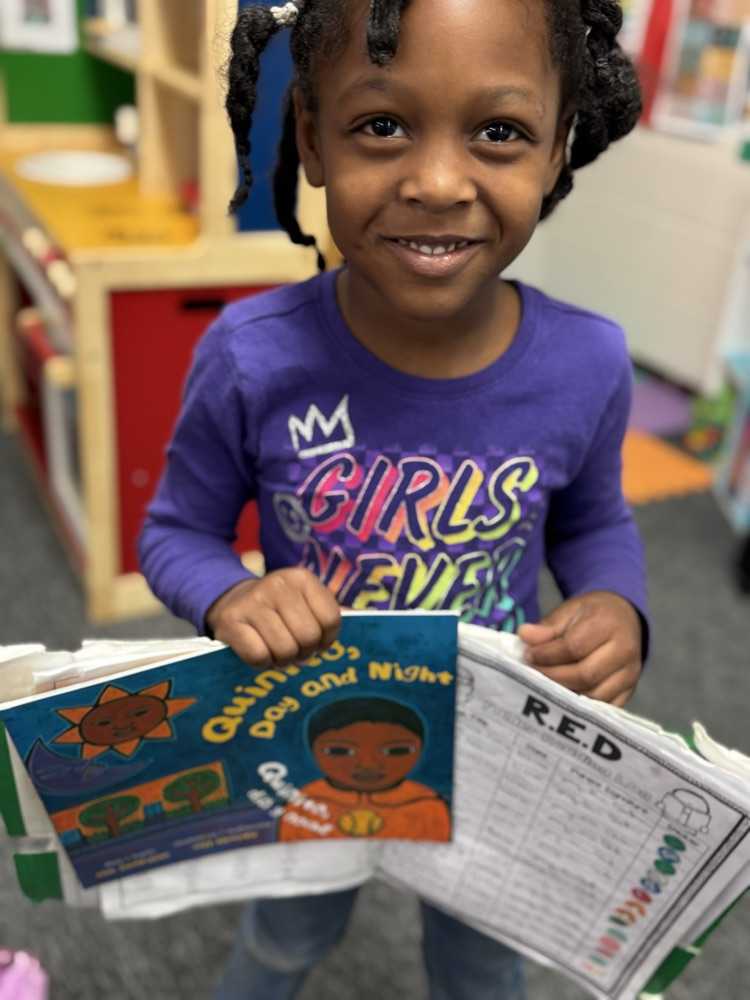 a student holding a book