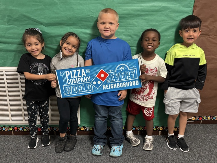 students holding a banner