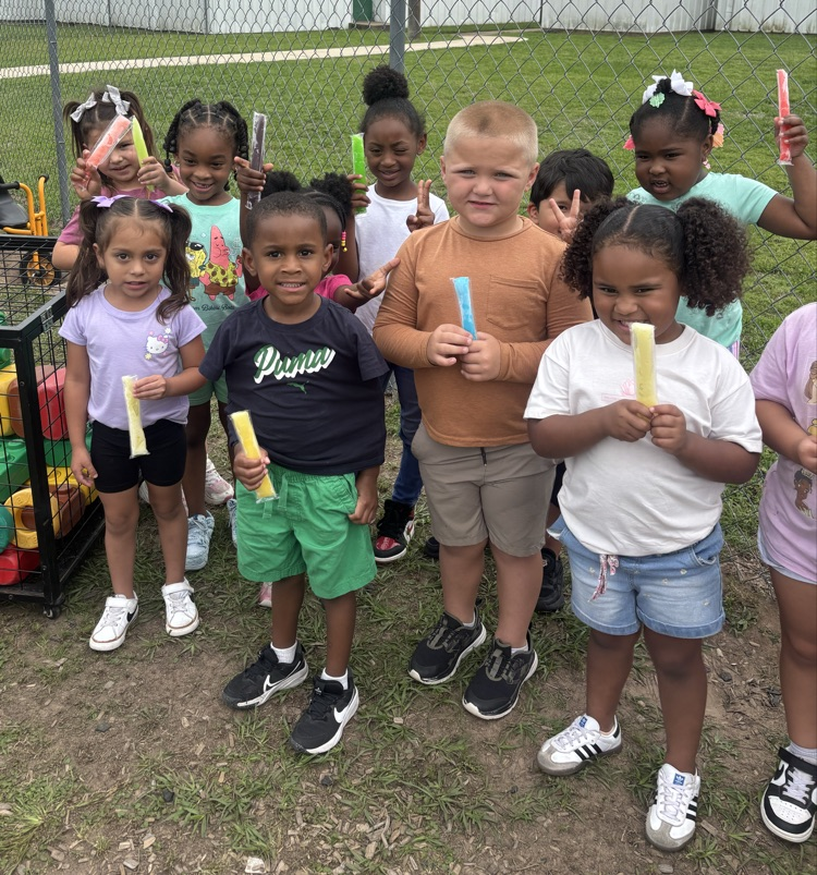 students holding ice pops