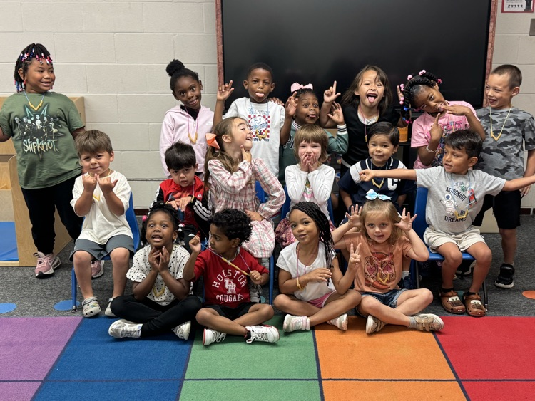 students wearing noodle necklaces