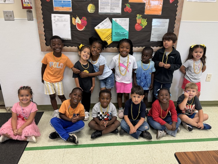 students wearing noodle necklaces