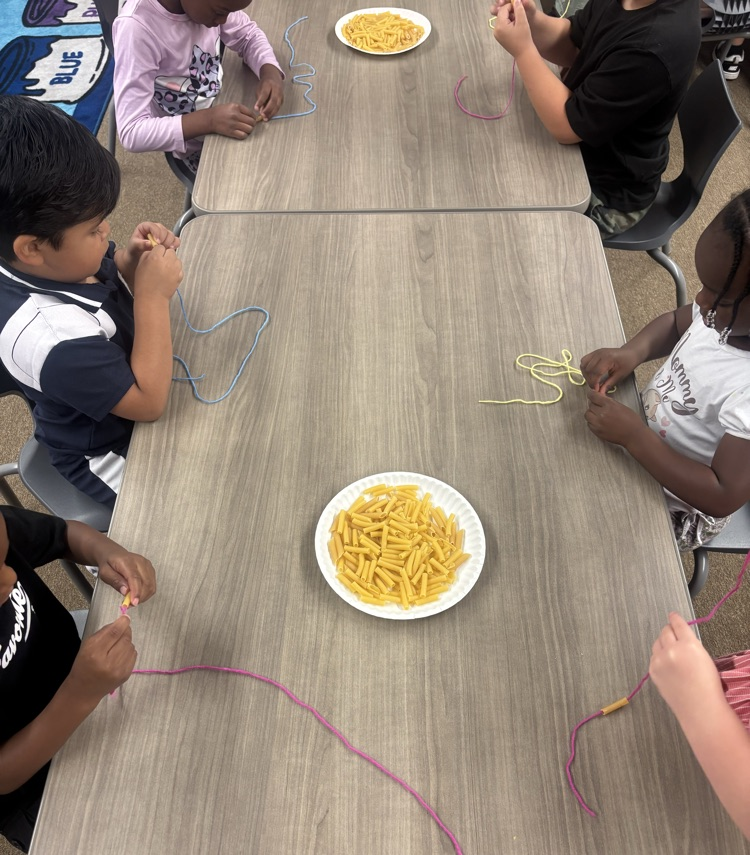 students wearing noodle necklaces