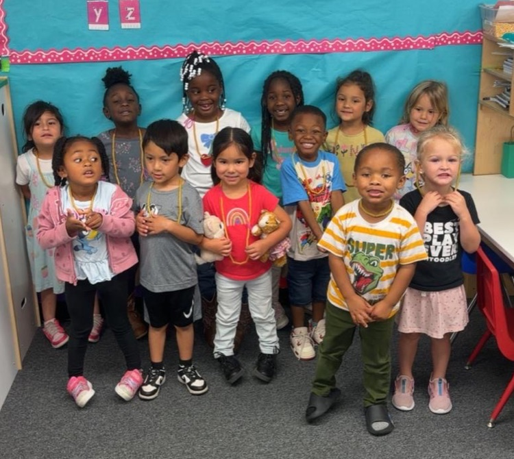 students wearing noodle necklaces
