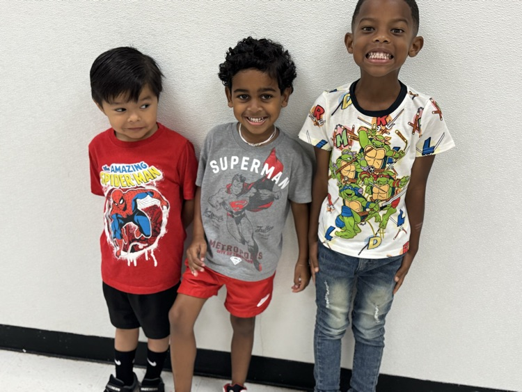 students in superhero shirts