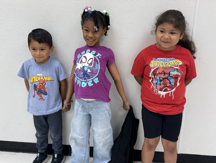 students in superhero shirts