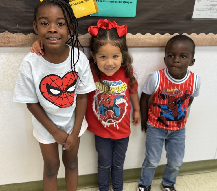 students in superhero shirts