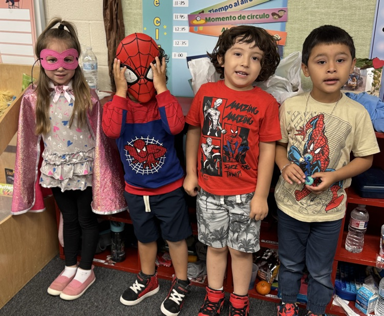 students in superhero shirts