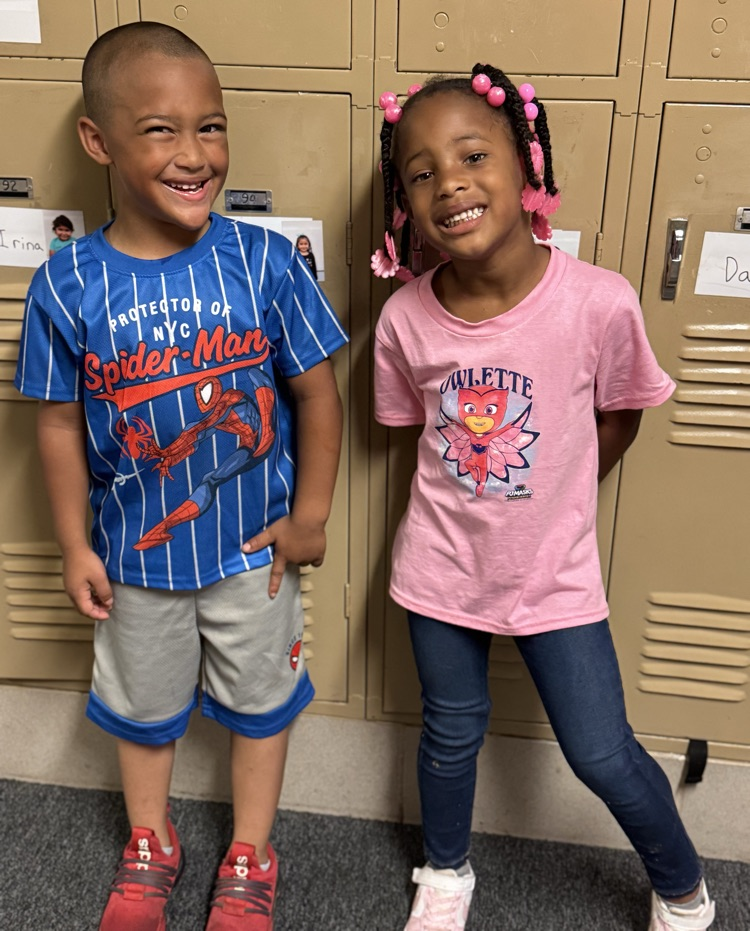 students in superhero shirts
