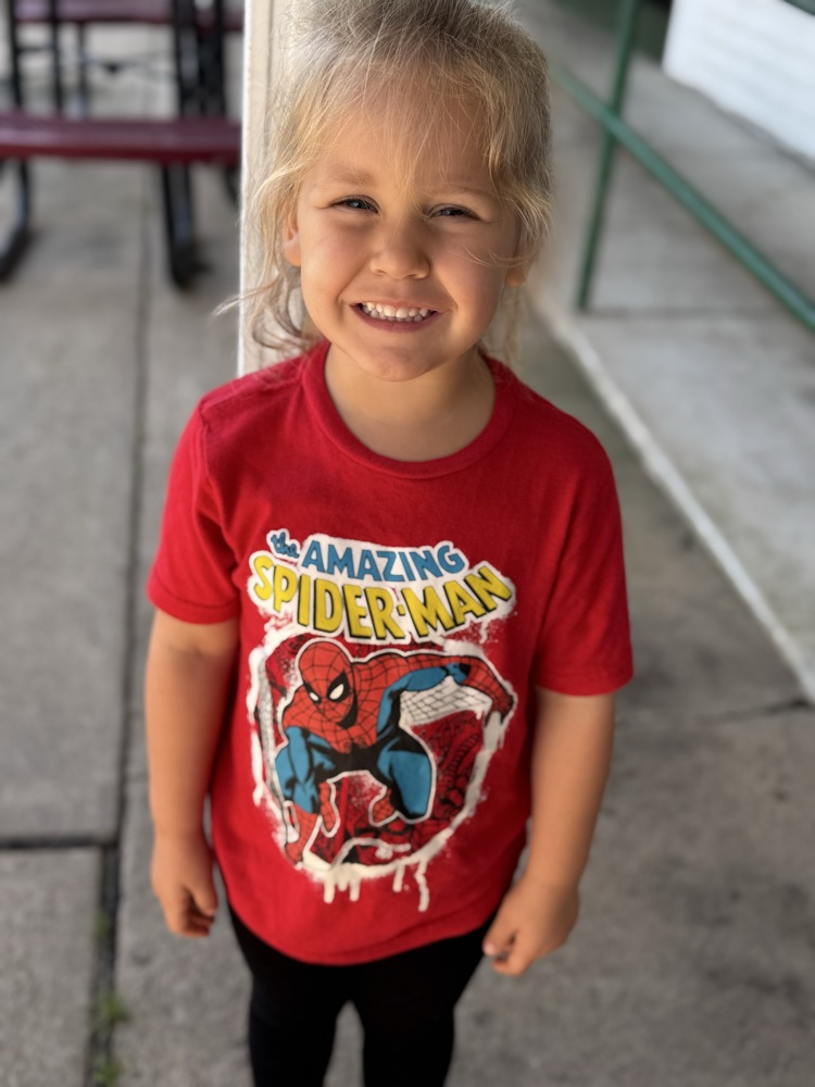 students in superhero shirts