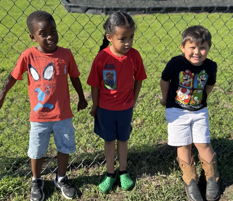 students in superhero shirts