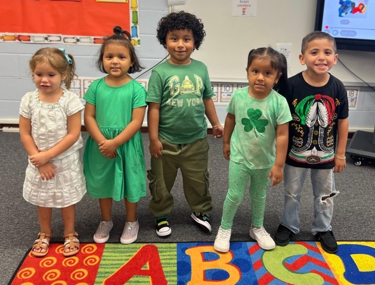 students wearing green