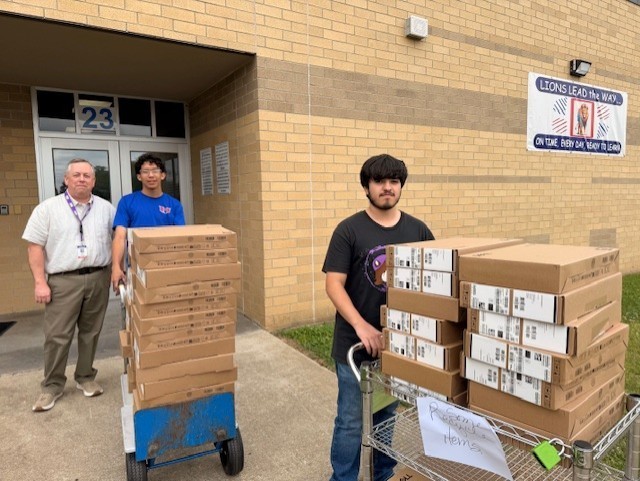 Students delivering computers
